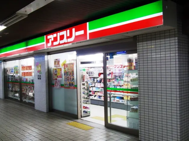 The image shows a convenience store with a sign on the side of it, illuminated by lights on the...