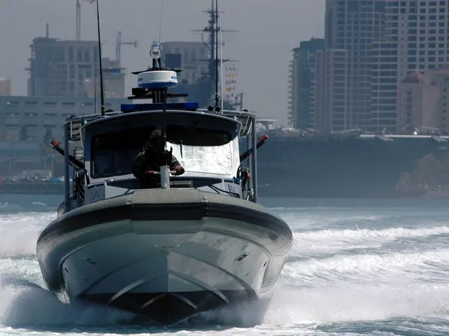 The image shows a patrol boat traveling through the water near a large ship, with people on board....